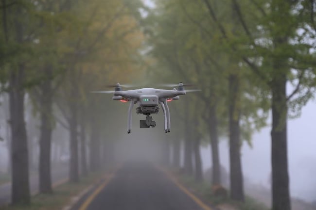 Drone flying on road 