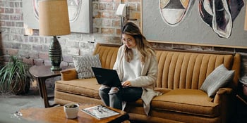 woman inside looking at laptop
